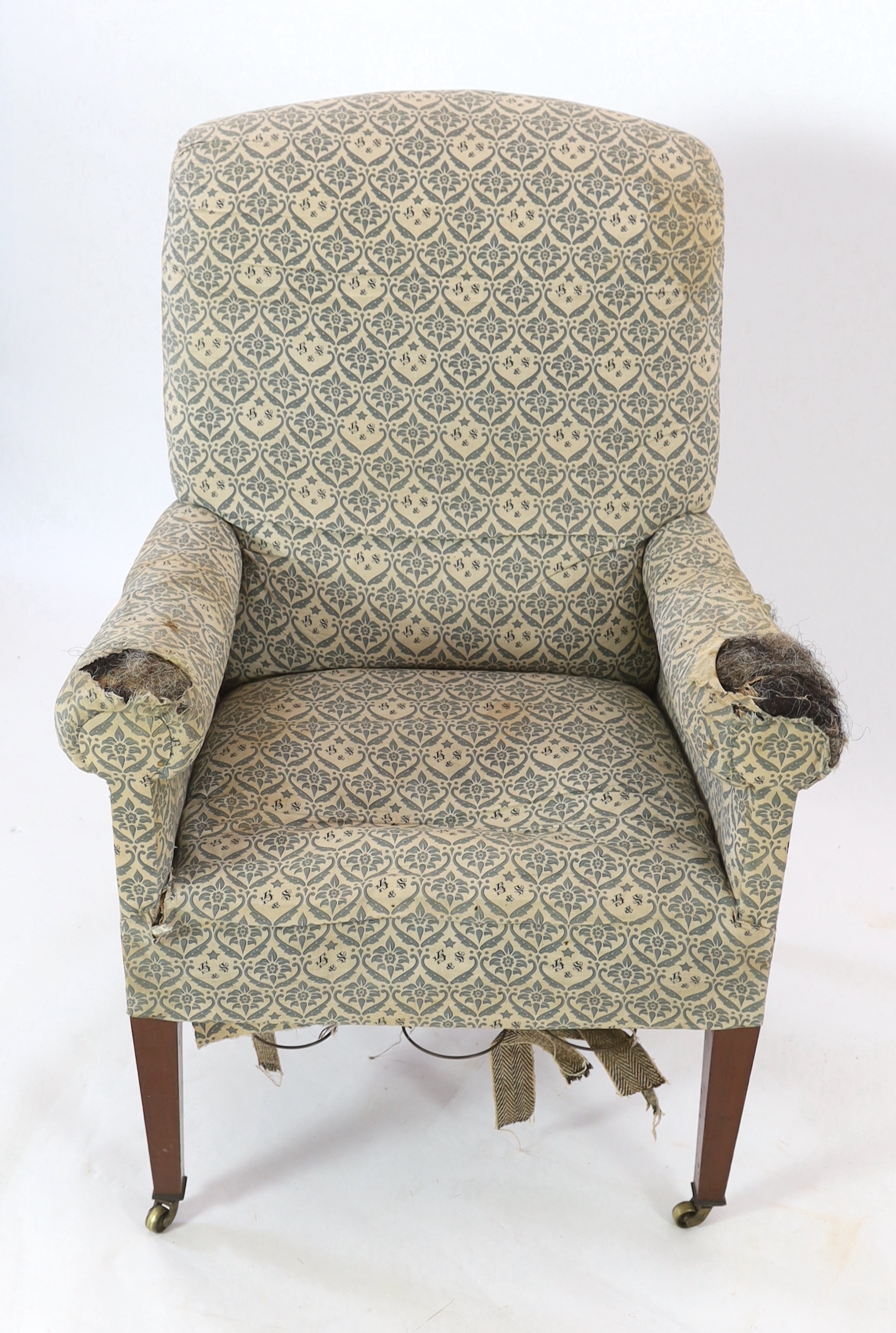 A late Victorian Howard & Sons armchair, width 80cm, depth 80cm, height 115cm